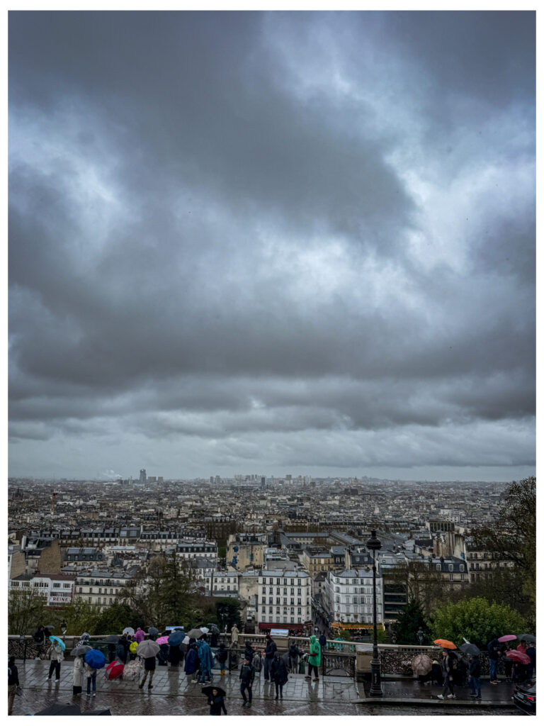 Rainy day view over Paris from Sacre Couer Basilica