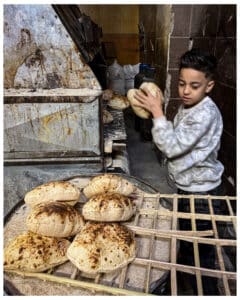 Removing the bread from the hot ovens needs to be done quickly!